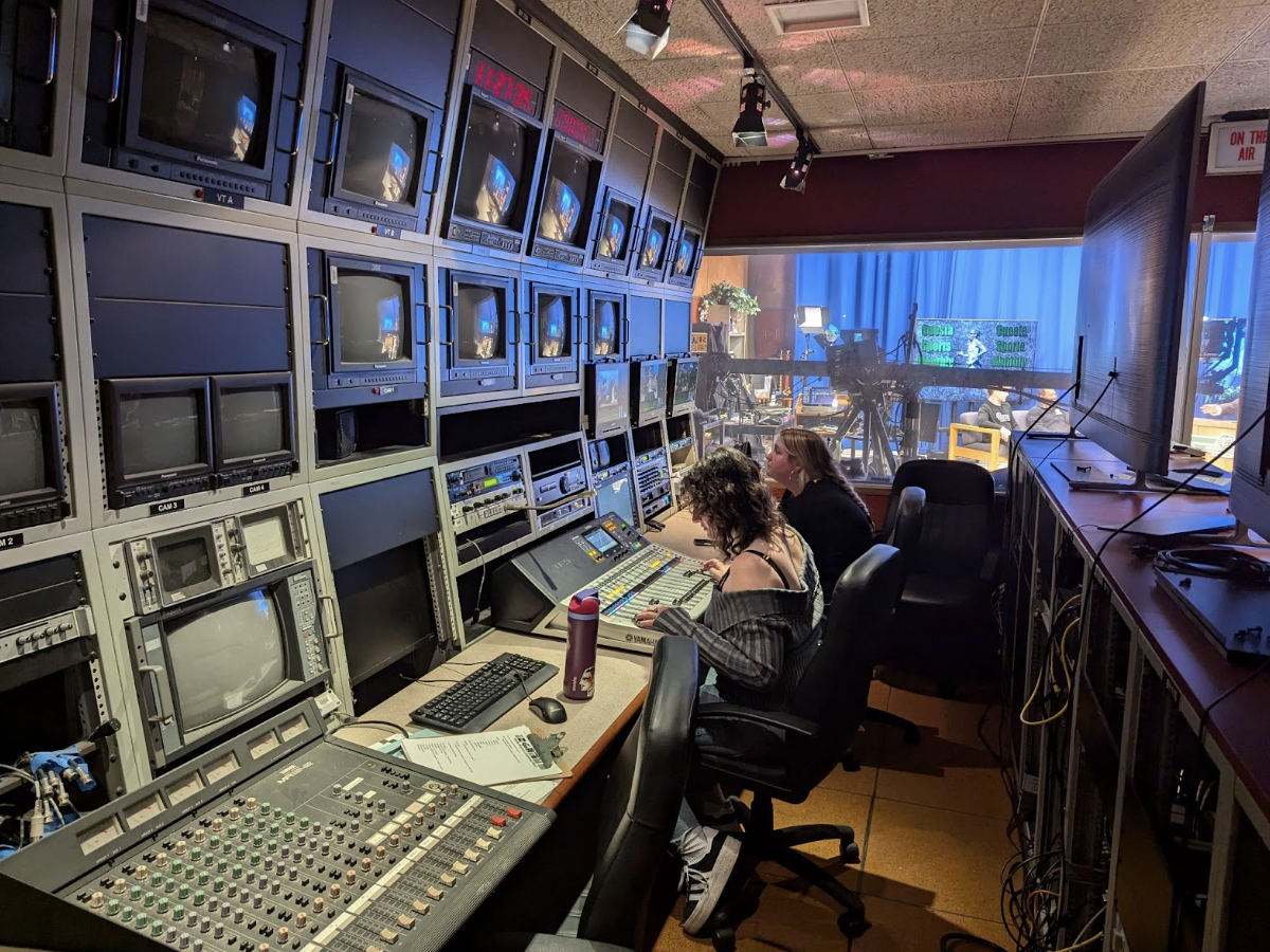 Video studio production students Cait McCormack and Muriel Emmons work behind the scenes of the November Cuesta Sports Monthly broadcast on Nov. 12, 2024. 